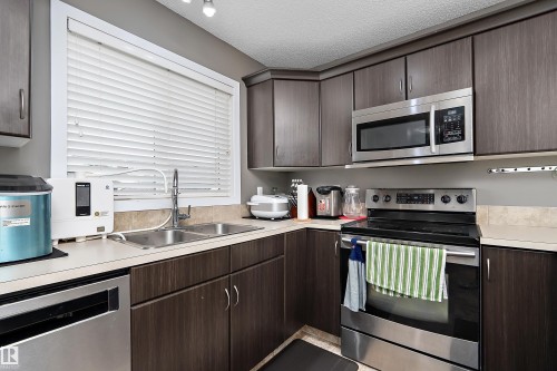306 Simmonds Way, Leduc, AB - Indoor Photo Showing Kitchen With Double Sink