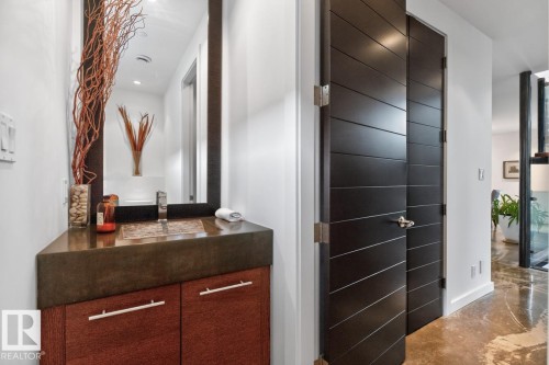Vanity featuring a mosaic-tiled basin, a concrete-finish countertop, and wood-finish cabinetry - 14A Birch Drive, St. Albert, AB 