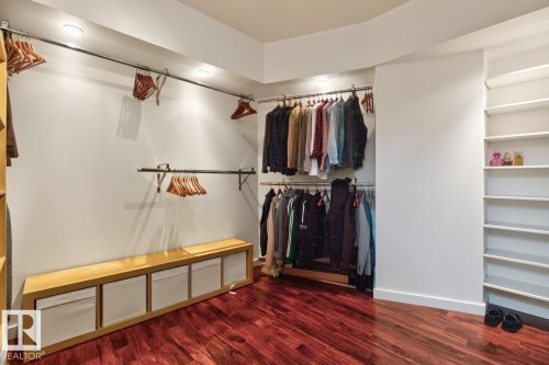 Hardwood flooring, recessed lighting, built-in shelving, and metal hanging rods - 14A Birch Drive, St. Albert, AB 