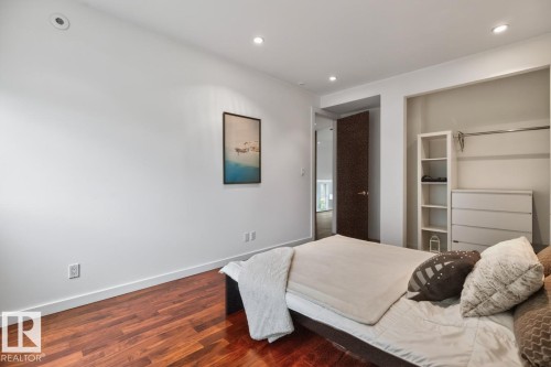Recessed lighting, wood-finish flooring, white walls, and built-in closet shelving - 14A Birch Drive, St. Albert, AB 