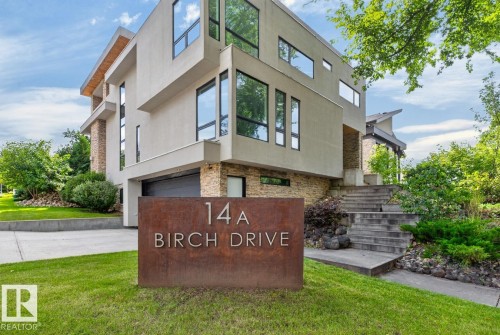Contemporary architectural design featuring stucco and stone-clad exterior - 14A Birch Drive, St. Albert, AB 