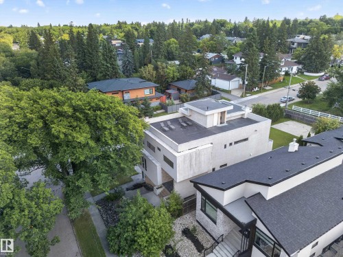 Modern architectural design with a flat roofline and integrated exterior lighting - 14A Birch Drive, St. Albert, AB 