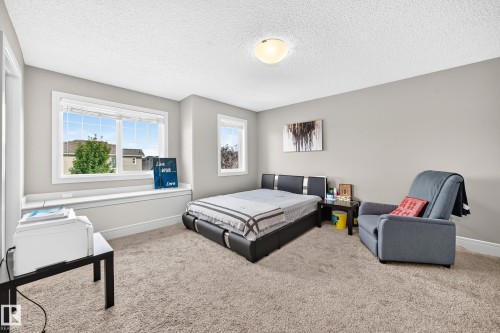 Plush carpeting, neutral wall tones, and a window seat with ample natural light - 12035 168 Avenue Nw, Edmonton, AB 