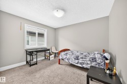 Light gray wall finish with a single window featuring white trim and blinds - 