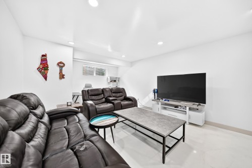 Recessed lighting illuminating a spacious room with light-toned flooring - 12035 168 Avenue Nw, Edmonton, AB 
