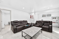 Recessed lighting throughout, white walls, and a window with horizontal blinds - 