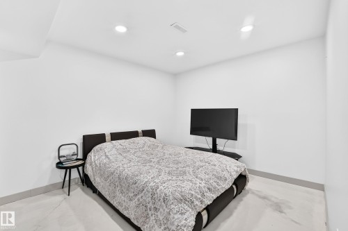 Recessed ceiling lighting with a flat white ceiling, white walls, and light-colored flooring - 12035 168 Avenue Nw, Edmonton, AB 