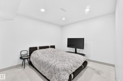 Recessed ceiling lighting with a flat white ceiling, white walls, and light-colored flooring - 