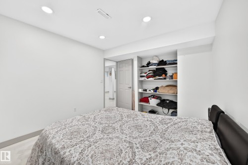 Recessed lighting illuminating a bedroom with built-in shelving - 12035 168 Avenue Nw, Edmonton, AB 