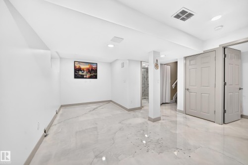 Polished flooring, recessed lighting, white walls, and paneled doors - 12035 168 Avenue Nw, Edmonton, AB 