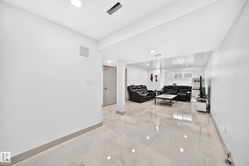 Spacious interior with polished flooring, recessed lighting, and a neutral color palette - 12035 168 Avenue Nw, Edmonton, AB 