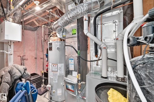 Water heater, HVAC system, exposed ductwork, exposed ceiling joists, utility piping - 12035 168 Avenue Nw, Edmonton, AB 