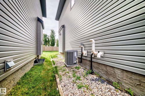 Vinyl siding exterior with a rock-lined foundation - 12035 168 Avenue Nw, Edmonton, AB 