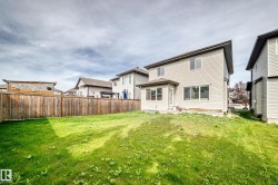 Expansive green space with wood fencing - 