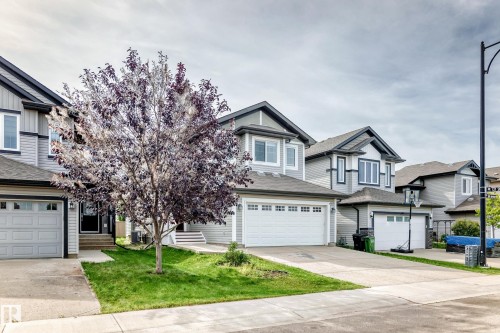 Gray siding exterior with white trim accents - 12035 168 Avenue Nw, Edmonton, AB 