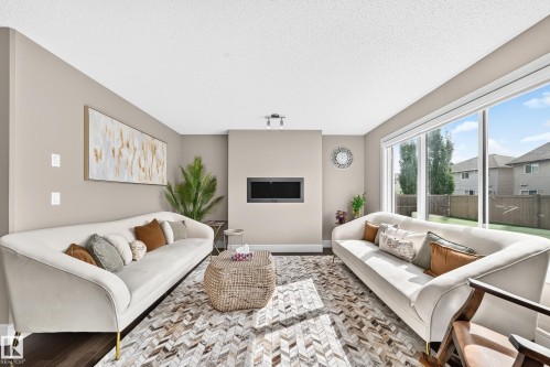 Integrated fireplace feature with track lighting - 12035 168 Avenue Nw, Edmonton, AB 