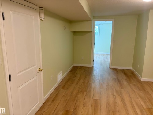 Wood-finish flooring throughout basement - 13219 107 Street Nw, Edmonton, AB 