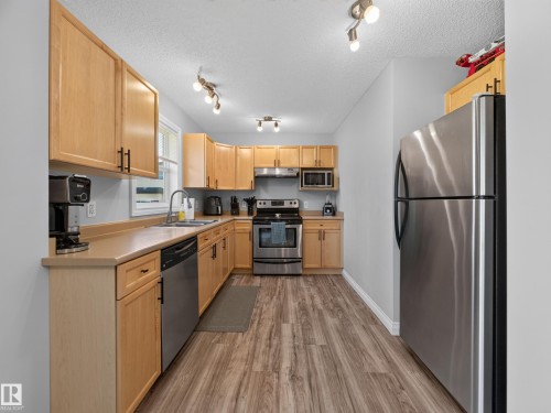 #44 12050 17 Av Sw, Edmonton, AB - Indoor Photo Showing Kitchen With Double Sink