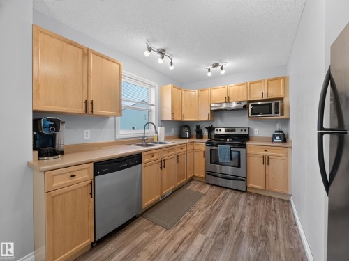 #44 12050 17 Av Sw, Edmonton, AB - Indoor Photo Showing Kitchen With Double Sink