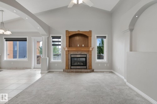 Vaulted ceiling with a ceiling fan, recessed lighting, and an arched entryway - 16807 78 Street Nw, Edmonton, AB 