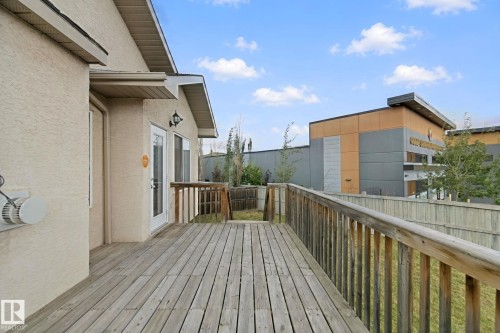 Private wood deck with a full railing system - 16807 78 Street Nw, Edmonton, AB 
