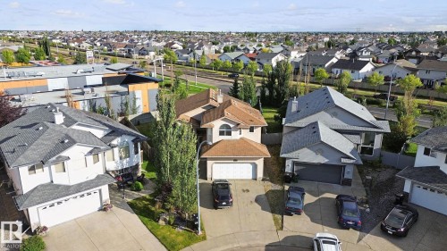 Suburban street with residential properties and varied rooflines - 16807 78 Street Nw, Edmonton, AB 