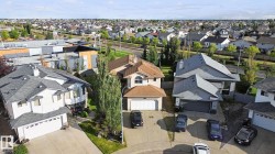 Suburban street with residential properties and varied rooflines - 