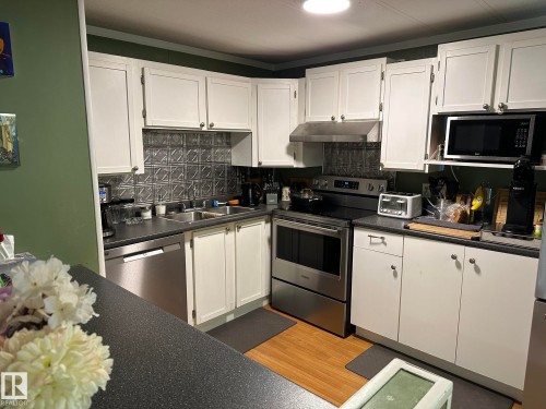 #68 4204 47 St, Wetaskiwin, AB - Indoor Photo Showing Kitchen With Double Sink