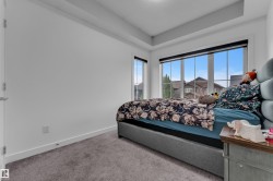 Tray ceiling and recessed lighting complement the bright interior - 