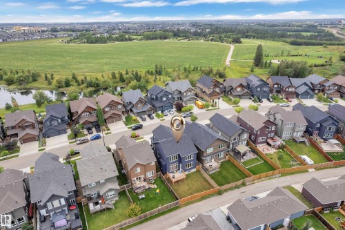 Residential neighborhood with varied architectural styles, green spaces, and water features - 1409 Graydon Hill Way Sw, Edmonton, AB 