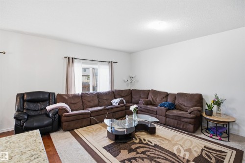 Recessed lighting, window with curtain rods, and a neutral wall palette - 1523 36 Avenue Nw, Edmonton, AB 