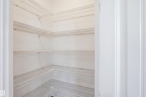 Built-in wire shelving system with multiple tiers, offering extensive storage capacity - 1523 36 Avenue Nw, Edmonton, AB 