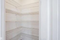 Built-in wire shelving system with multiple tiers, offering extensive storage capacity - 