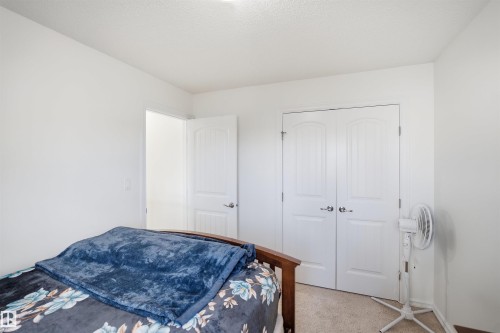 White interior walls, white paneled doors, and carpet flooring - 1523 36 Avenue Nw, Edmonton, AB 