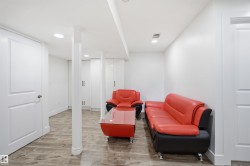Recessed lighting, wood-finish flooring, white walls, built-in cabinetry, and white paneled doors - 