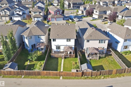 Two-story residence with a pitched roof, rear deck, and fenced backyard - 1523 36 Avenue Nw, Edmonton, AB 
