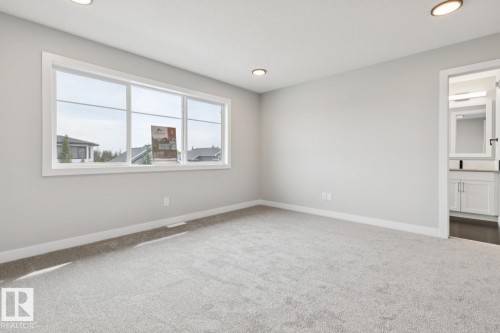 Wall-to-wall carpeting and neutral wall tones - 72 Maple Crescent, Gibbons, AB 