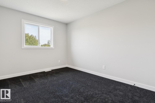 White walls with dark gray carpeting - 36 Maple Crescent, Gibbons, AB 