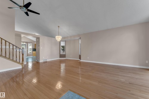 Hardwood flooring, vaulted ceilings, and a tiered chandelier - 9722 157 Street Nw, Edmonton, AB 