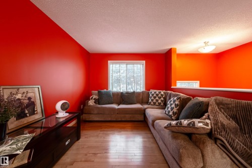 Wood-finish flooring, recessed window, and flush-mount ceiling light fixture - #31 460 Hemingway Rd Nw, Edmonton, AB 