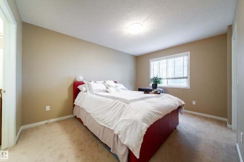 Window with blinds, wall-to-wall carpeting, and a flush mount ceiling light - #31 460 Hemingway Rd Nw, Edmonton, AB 