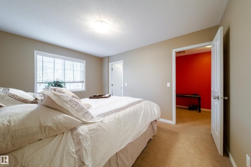 Recessed window with blinds, overhead flush-mount lighting, neutral wall paint, and carpeted flooring - #31 460 Hemingway Rd Nw, Edmonton, AB 