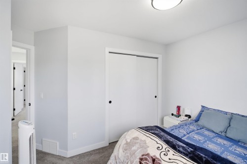 Recessed lighting, sliding closet doors, and carpeted flooring - 2122 37 Avenue Nw, Edmonton, AB 