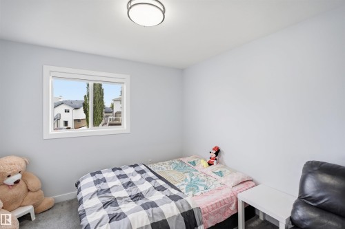 Recessed window with white trim, light gray walls, and gray carpet flooring - 2122 37 Avenue Nw, Edmonton, AB 