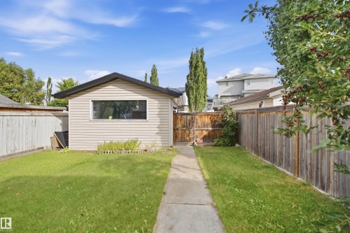 Detached outbuilding with horizontal siding and an extended roofline - 2122 37 Avenue Nw, Edmonton, AB 