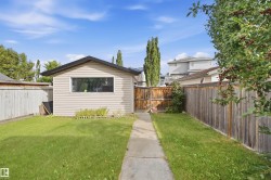 Detached outbuilding with horizontal siding and an extended roofline - 