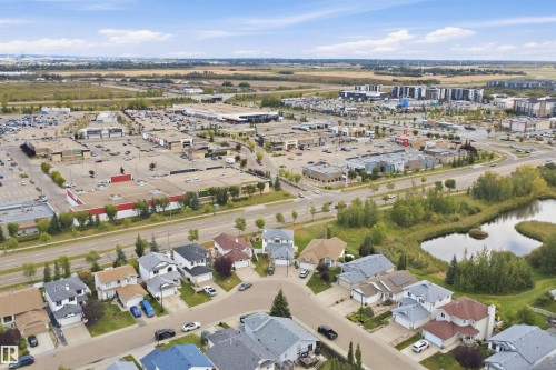 Residential neighborhood with single-family homes, commercial centers, and natural water features - 2122 37 Avenue Nw, Edmonton, AB 