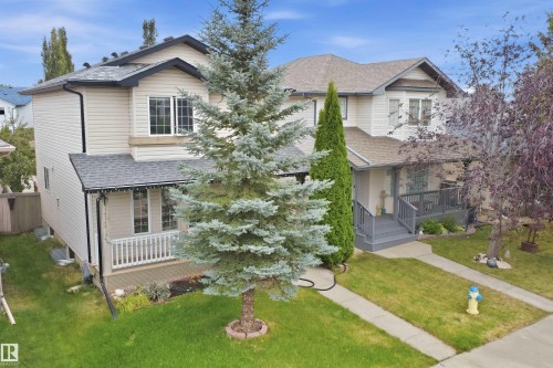 Two-story residential architecture with light-colored siding - 2122 37 Avenue Nw, Edmonton, AB 