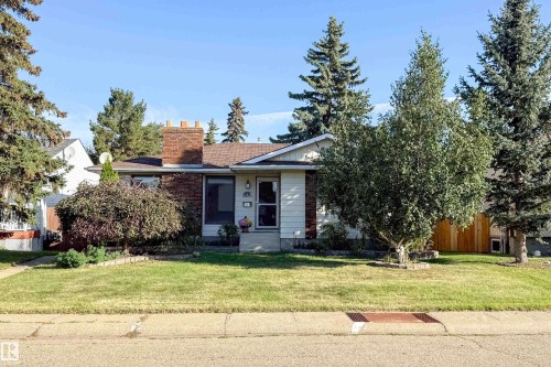 Brick chimney accenting the front facade - 10438 32A Avenue Nw, Edmonton, AB 
