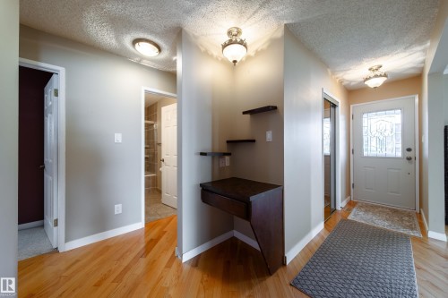 Wood-finish flooring throughout the space - 10438 32A Avenue Nw, Edmonton, AB 